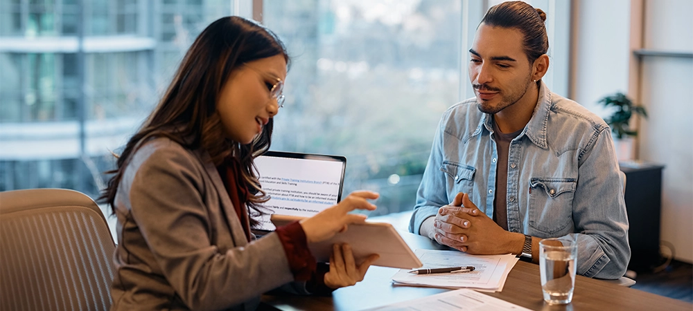 insurance agent consult with client discussing about policies, vehicle fine insurance