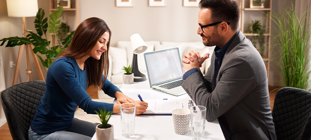 Young woman signs a contract