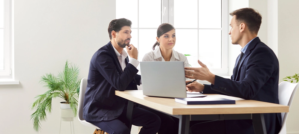 Agent consulting family couple clients to make sale purchase, insurance contract during meeting with estate agent, lawyer or bank manager, customers make financial deal, office business talk to plan
